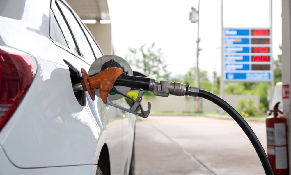 A petrol pump fills up a petrol car