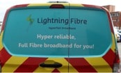 rear view of a van with 'lightning fibre' logo