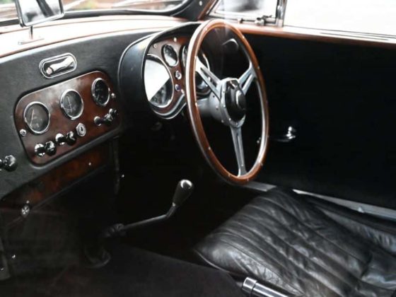 interior shot of the driver's seat of a classic car