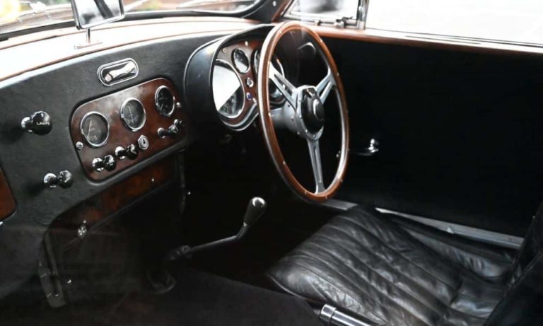 interior shot of the driver's seat of a classic car