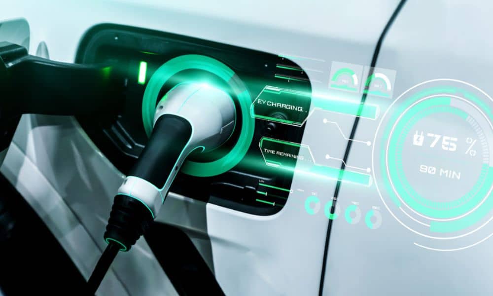 An electric charger plugged into an EV