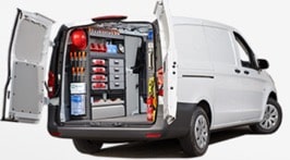 White van with back doors open displaying interior customisation for tools and hardware